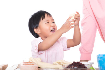 Chinese children kneading dough to make moon cakes