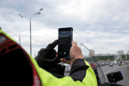 officer taking a picture of traffic