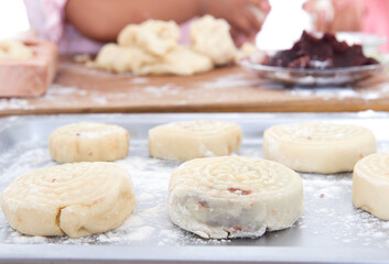 Fototapeta na wymiar Make Mid-Autumn Festival gourmet mooncakes waiting to be baked