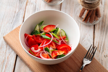 Fresh vegetables salad with cucumbers and tomatoes