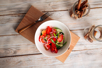 Fresh vegetables salad with cucumbers and tomatoes