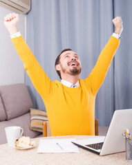 Young man talking on video communication with relatives on laptop at home