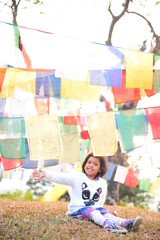 girl under the sacred flags peace and happiness