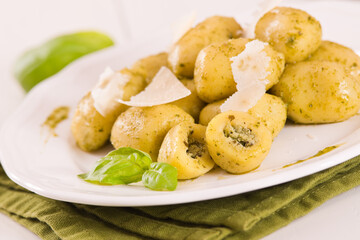 Potato gnocchi stuffed with pesto sauce.