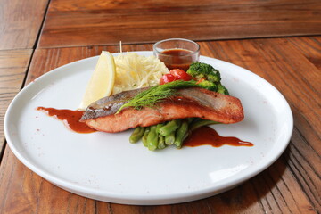 Grilled salmon with fresh vegetable salad