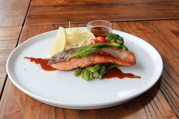 Grilled salmon with fresh vegetable salad