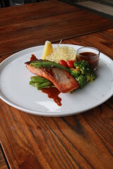 Grilled salmon with fresh vegetable salad