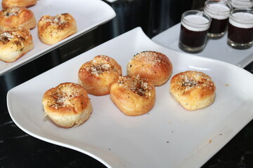 Fresh homemade bread on white plate.