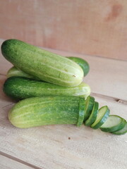 fresh cucumber during the day on a wooden background