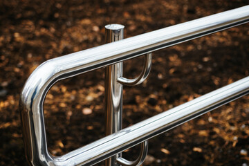 Metal chrome railing on the street, close-up. Accessible urban environment