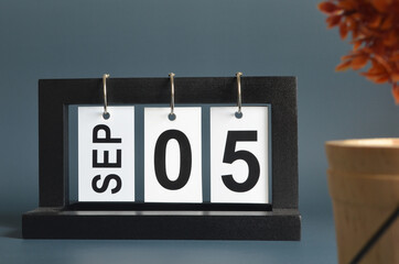 September 5, Date design with a black wooden calendar for a business, Date Plans to remind.