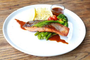 Grilled salmon with fresh vegetable salad
