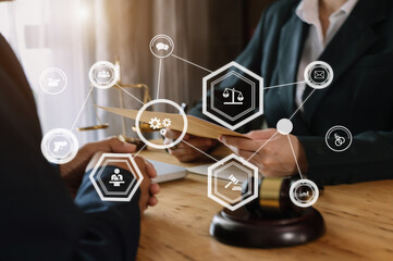 Business and lawyers discussing contract papers with brass scale on desk in office. Law, legal services, advice,  justice and law concept ..