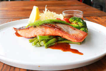 Grilled salmon with fresh vegetable salad
