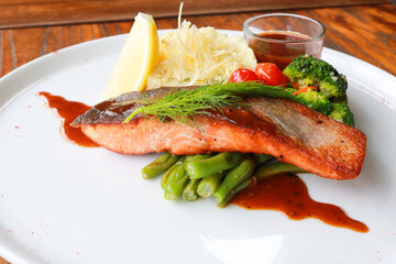 Grilled salmon with fresh vegetable salad