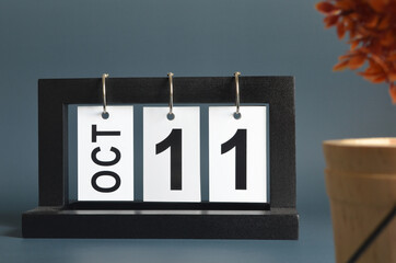 October 11, Date design with a black wooden calendar for a business, Date Plans to remind.