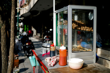 hawker street food in the city. street food cart called pentol or bakso in the pedestrian