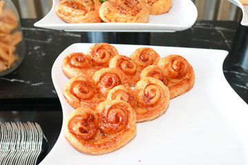 Fresh homemade bread on white plate.