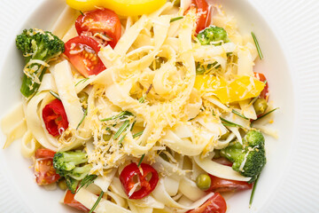 Tasty pasta primavera on plate, closeup