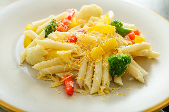 Tasty pasta primavera on plate, closeup