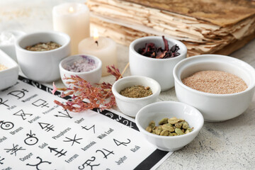 Alchemical symbols and ingredients for preparing potions on light background