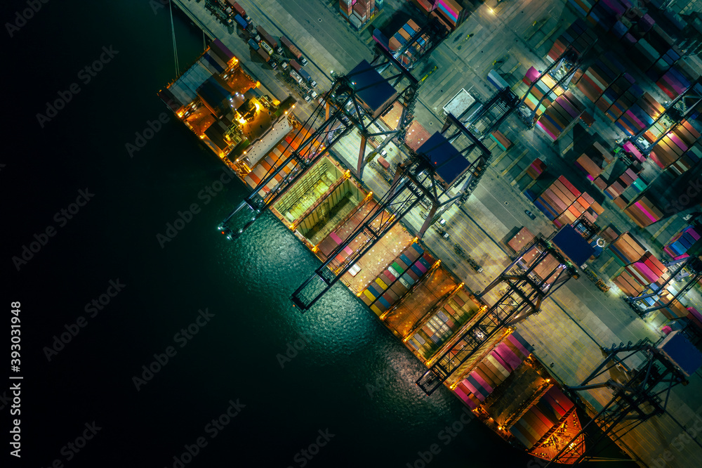 Canvas Prints container ship loading and unloading in deep sea port, aerial view at night