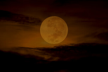 Orange full moon on the sky.