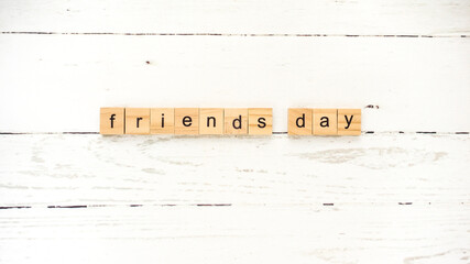 friends ' day.words from wooden cubes with letters photo