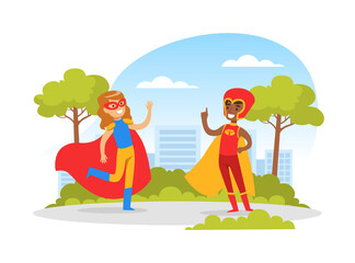 Obraz na płótnie Canvas Cute Boy and Girl Dressed in Superhero Costumes Playing Outdoors, Happy Kids Having Fun in Park Cartoon Vector Illustration