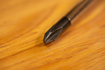 black Phillips head screwdriver on a table