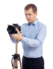 portrait of male photographer or videographer taking photo or shooting video with modern dslr...