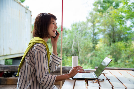 Woman Teleworking on an Outdoor Office as New Normal Work Style