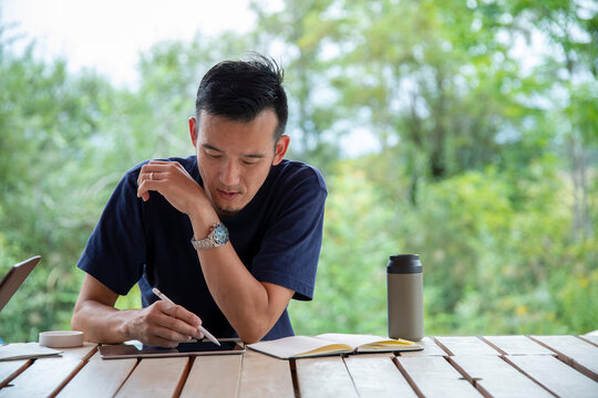 Man Teleworking on an Outdoor Office as New Normal Work Style