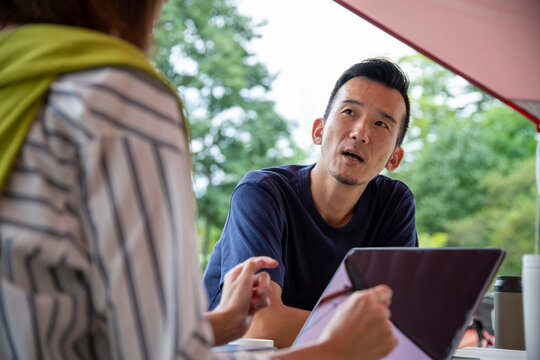 Man and Woman Having a Meeting on an Outdoor Office as New Normal Work Style