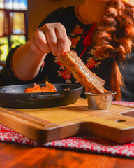 Delicious dinner and clean eating concept from above. Fried meat in a pan, on vintage background flat-lay.