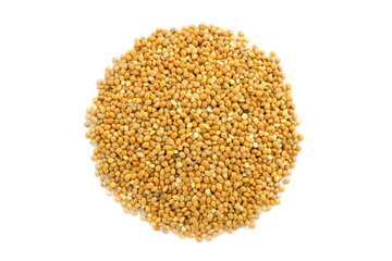 Heap of unprocessed millet seeds isolated on white background, top view. Heap of yellow millet groats isolated on white. Yellow millet on a white background, top view.
