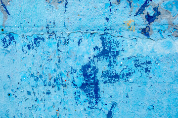 Deteriorated surface covered with blue paint
