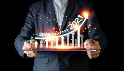 Plan business growth in year 2021 concept. Businessman plan and increase of positive indicators in his business, Growing up business concepts.
