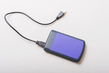 Close up photo of violet portable hard disk.