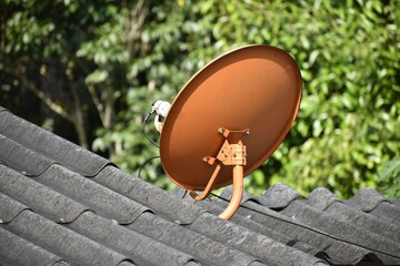 Orange satellite dishes are on the roof.