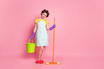 Full size photo of housewife hold bucket mop wear yellow skirt latex violet gloves isolated over pastel color background