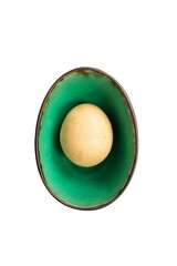 Natural chicken egg in a ceramic dish on a white background. Top view, place for text, vertical image.