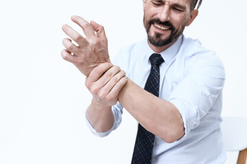 A man shows on camera his wrist which he bruised. 