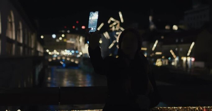 Woman take selfie city Christmas lights on a local travel mid pandemic