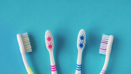 Toothbrushes on a blue background. Top view