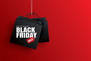 Black friday sale with black shopping bag and the rope hanging on red background