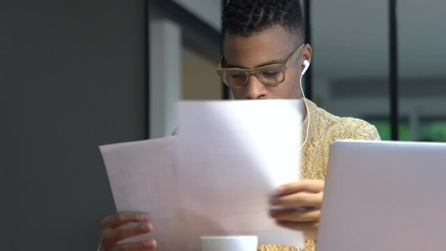 Portrait of african american trendy guy in a distant online call