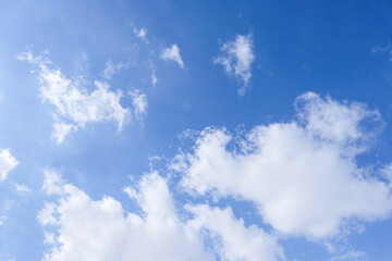Fototapeta na wymiar Bright blue sky with snow-white clouds speak of purity and freshness.