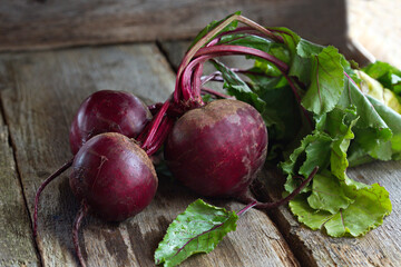 Beet, beetroot bunch on grey wooden background.