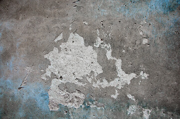 gray old wall. dark concrete texture. crumbling plaster on the building. discreet creative background